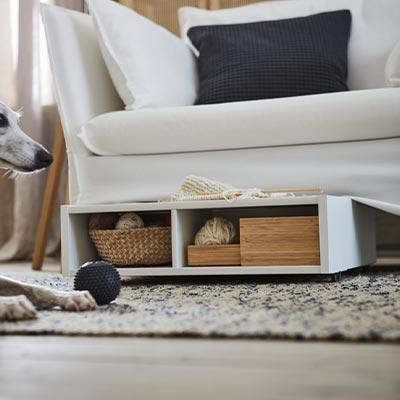 Under furniture storage for dog toys
