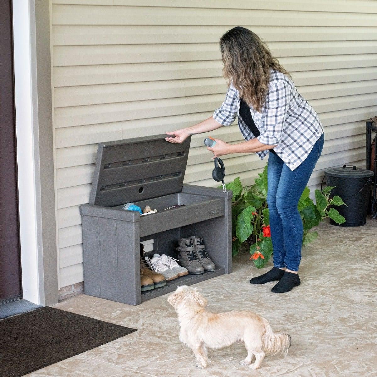 Outdoor bench storing dog walking gear