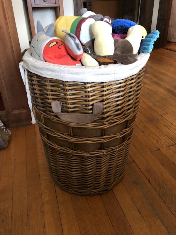 Laundry basket filled with dog toys