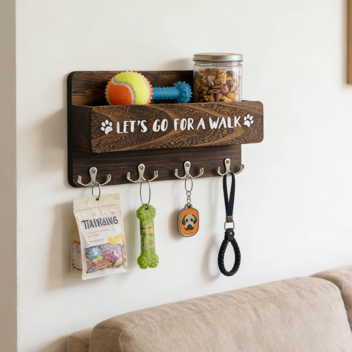 Wall hooks holding dog leads and toys